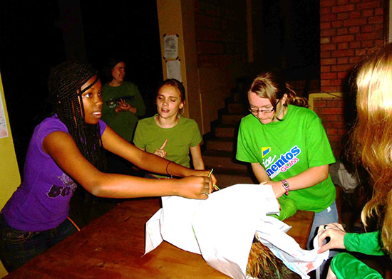 Young Life members in Kingali attempting to wrap up a chicken in a game they played during a recent meeting.