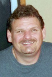 Neil A. Davis, age 43