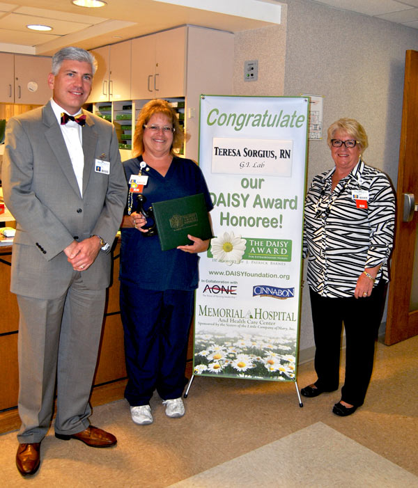 Pictured from left to right: Kyle Bennett, Executive Vice President and COO, Teresa Sorgius, RN, and Tonya Heim, Vice President of Patient Services and CNO.