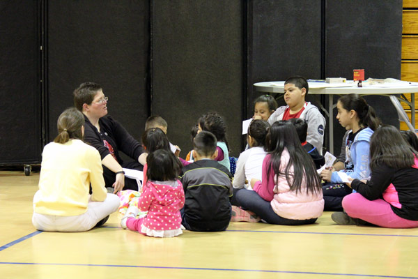Sister Jill Reuber discusses the scripture passage about the prodigal son with elementary school children at a recent Latino faith formation day at Monastery Immaculate Conception in Ferdinand. Photo provided