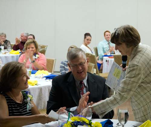 Linda White presented Nancy Eckerle with a check to give to Tenth Street Elementary.
