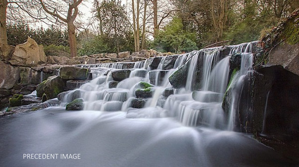 This a cascade similar to what the designers envision in The Parklands. This was built with a concrete barrier and then the rocks wear added to give it a natural effect.
