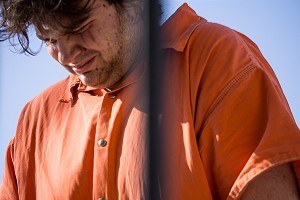 Kyle Popplewell kept his head down as he was escorted into the Dubois County Courthouse for his arraignment in the murder and rape that occurred early Sunday morning in St. Henry.