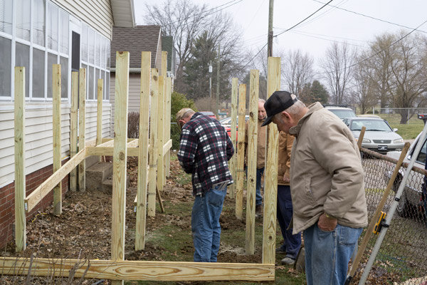 Irvin Blemker looked on as the frame and posts were being set for the ramp to Thyen's home.
