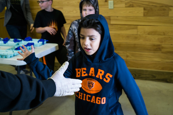Diego Gonzalez, 8, of Mrs. Yarbrough's class gave volunteer Bob Boyles a high five as the classes left Friday morning.