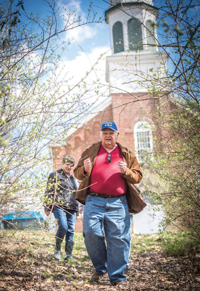 Dowser Duane Walter attempted to find some of the graves of stillborn infants buried on the hillside near the Chapel of Our Sorrowful Mothers in Ferdinand but because of the difficult terrain and extensive area, he was unsuccessful. If some clues can be found, another attempt will be made. ? Photo by Eric Tretter
