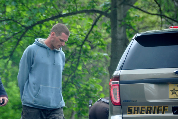 Deputies taking Justin McDonald into custody.