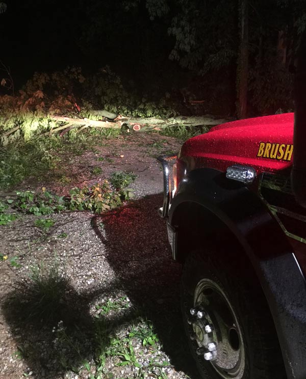 Tree down across Schnellville Road being cleared by Schnellville Volunteer Fire Department and local farmers.