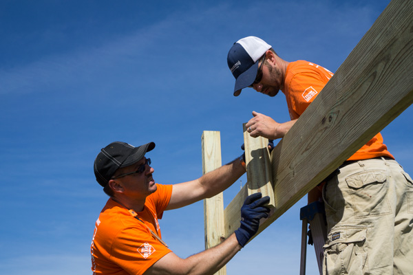 Matt Walker, Jasper Home Depot store manager, and Home Depot employee Nick Heichelbech worked on the practice field shelter houses Saturday. Ten Home Depot employees convened at the project as volunteers. According to Walker, the company promotes community involvement and all the volunteers were helping on their own time. 