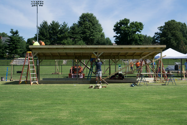 About 35 people showed up to build the shelters at the high school soccer fields Saturday.