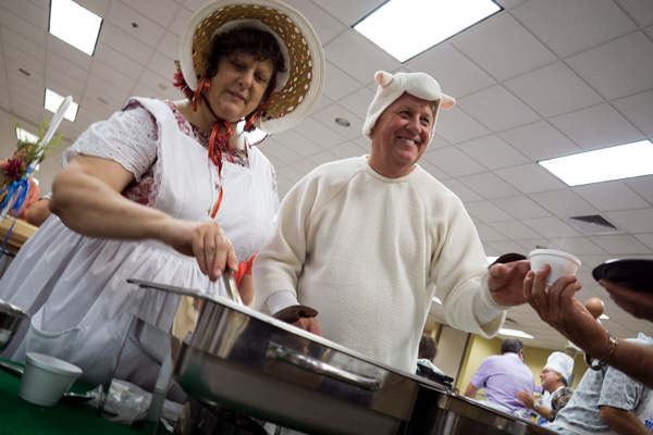Aimee Blumie and Hank Menke were Little Bo Peep and her sheep as they served up a lamb dish (Kebsa and saffron rice) at the 100 Men Who Cook. 