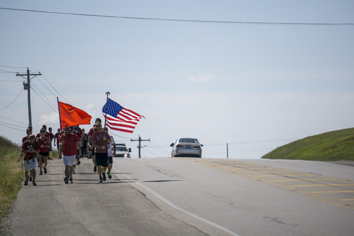 The team approaches State Road 161 on the 11-mile trek. 