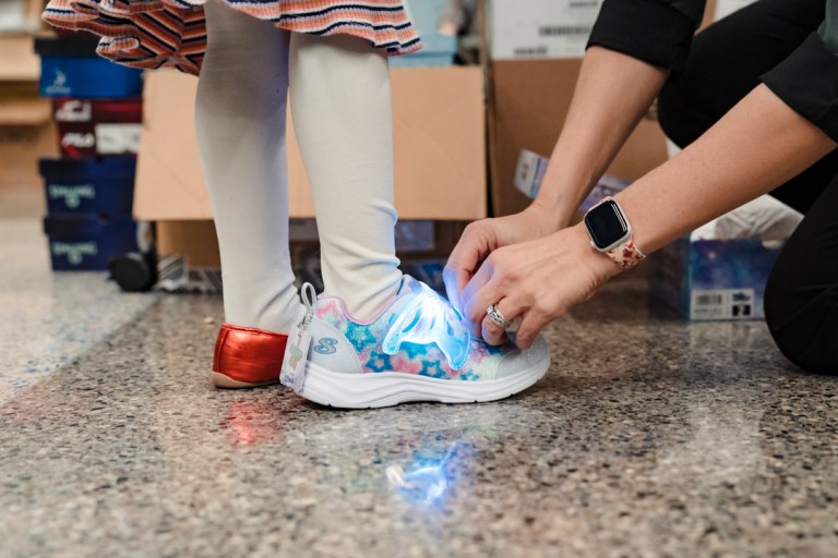 Red, White and Brauen delivers more than 350 pairs of shoes to Dubois County kids