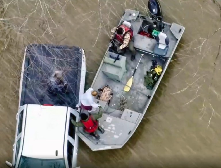 Conservation officer rescue pair swept into Pike County floodwaters